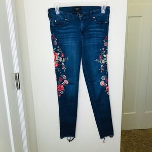 Denim jeans with flower design down sides of legs